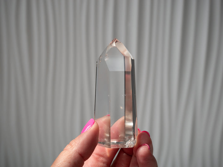 Extra High-Grade Clear Quartz Point in hand